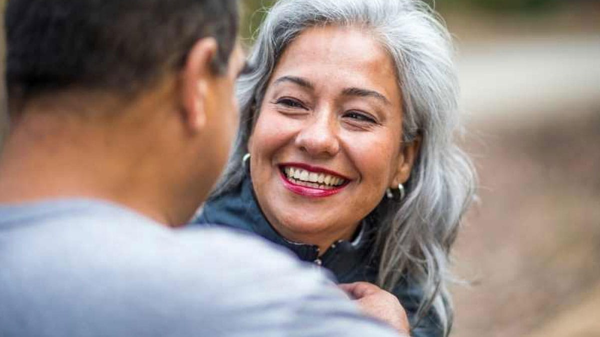 Mature woman talking to man