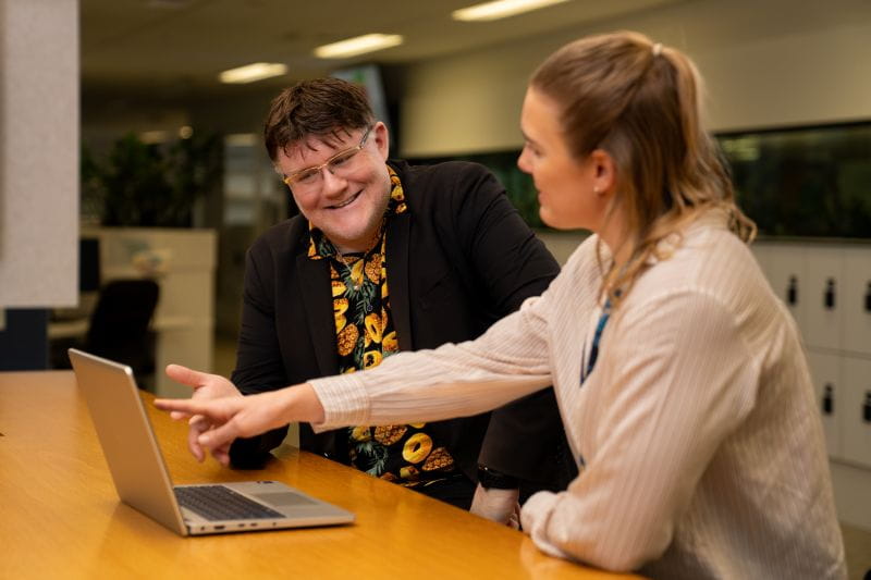 HBF contact centre consultant wearing a headset while assisting members from an office workstation.
