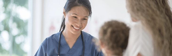 Female doctor smiling at patients