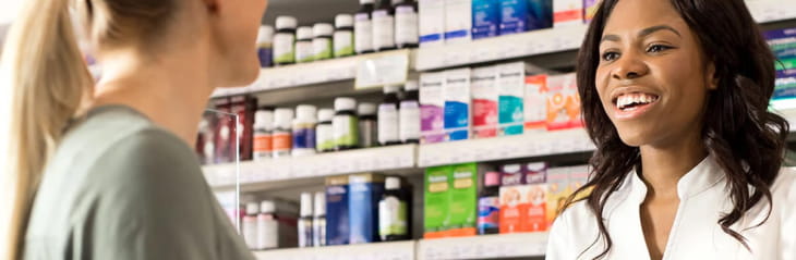 Woman speaking to a pharmacist