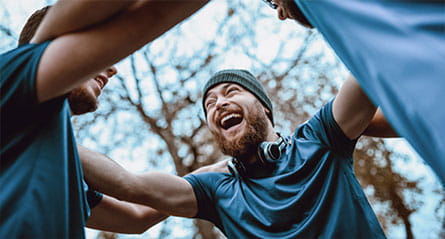 Group of men in huddle