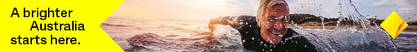 CommBank sponsors banner of man paddling in surf